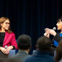 Melissa Harris-Perry, left, chats with President Mantella who has a microphone in her hand